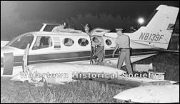 A group of people standing next to an airplane

Description automatically generated with low confidence