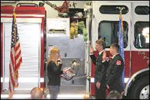 A group of people standing next to a firetruck

Description automatically generated with medium confidence