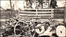 An old wooden cart with wheels

Description automatically generated with medium confidence