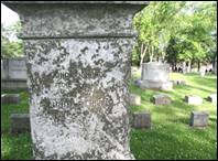 A close-up of a tombstone

Description automatically generated