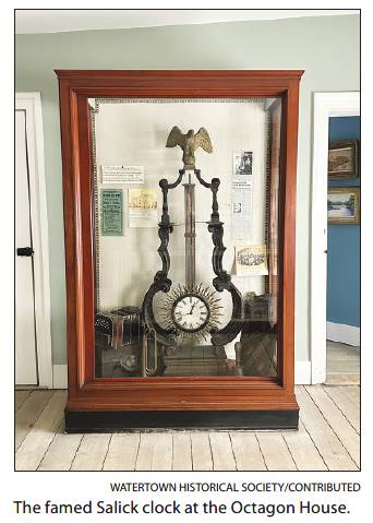 A clock in a glass case

AI-generated content may be incorrect.